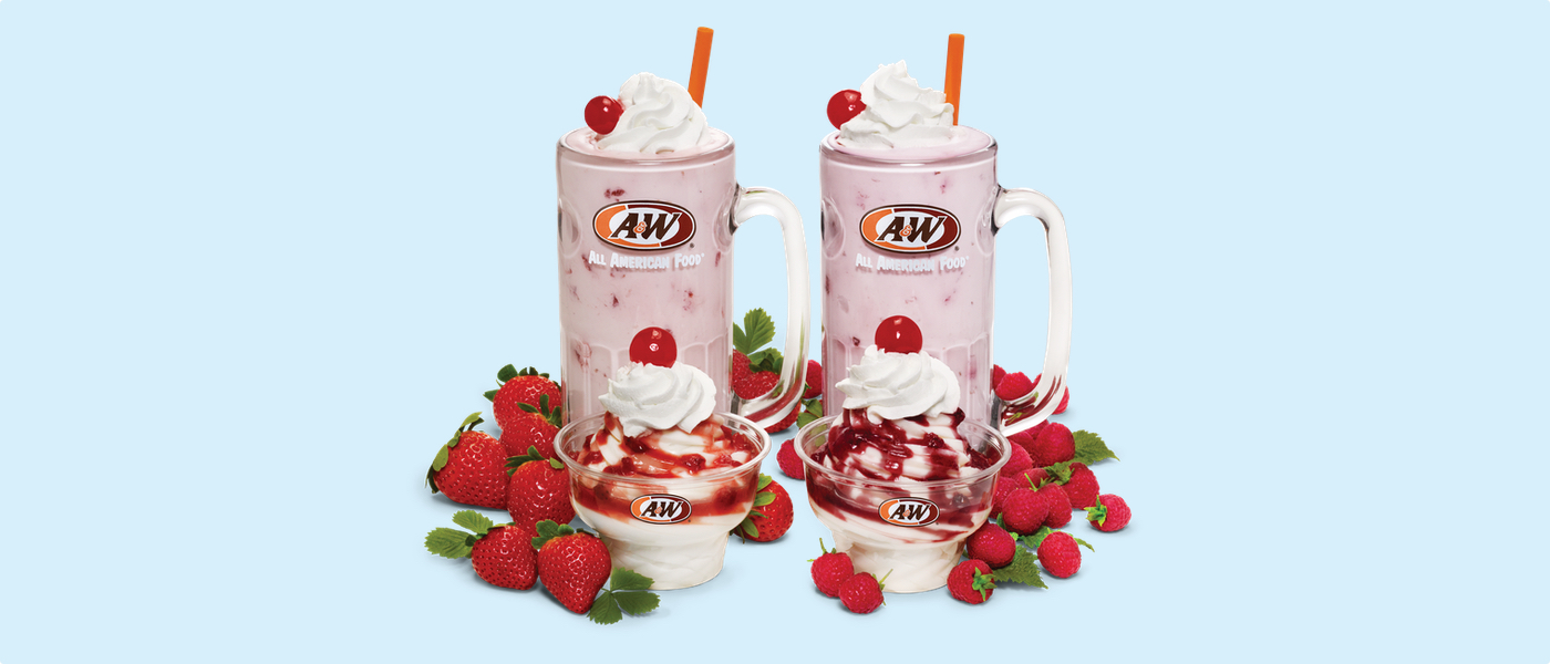 The background is light blue. Photo of a Strawberry Shake and Strawberry Sundae are on the left side of the image surrounded by real strawberries. Photo of a Raspberry Shake and Raspberry Sundae are on the right side of the image surrounded by real raspberries.
